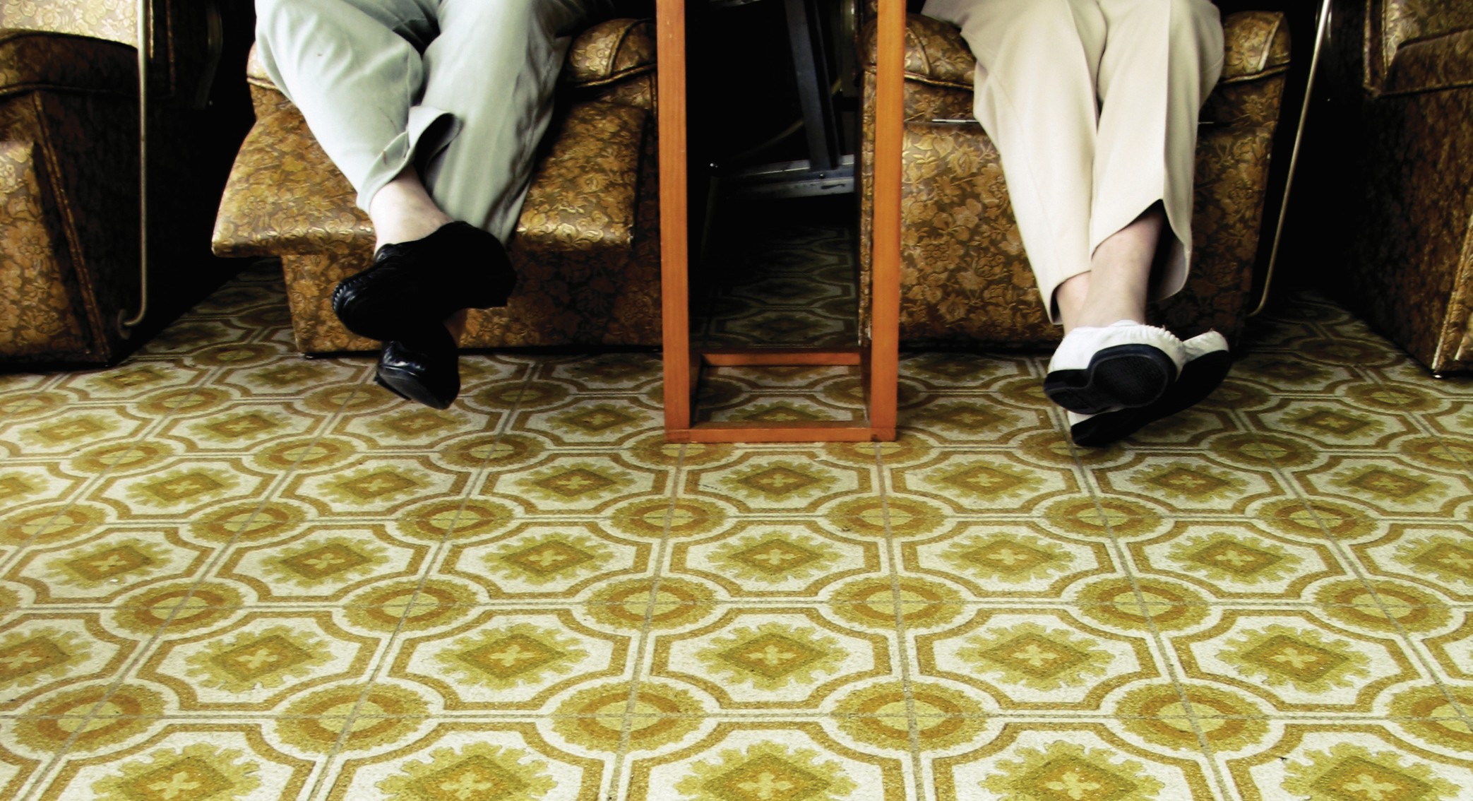 Underneath carpet or vinyl flooring