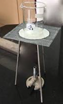 Figure 2 - Gauze mat sitting on tripod over Bunsen burner