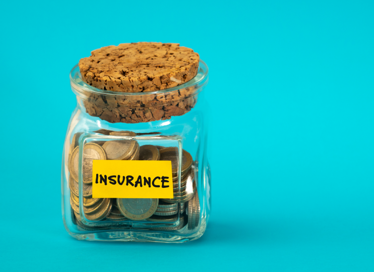 Jar with stopper with coins inside, labelled with the word insurance