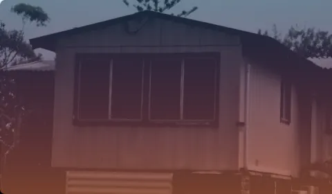 A house tinted orange and dark blue.