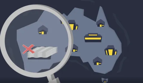 An image of Australia, with buildings drawn on it and a magnifying glass hovering over it