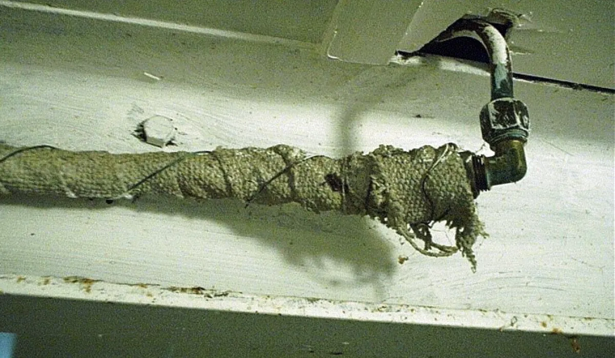 Asbestos textile wrapped around HW pipe